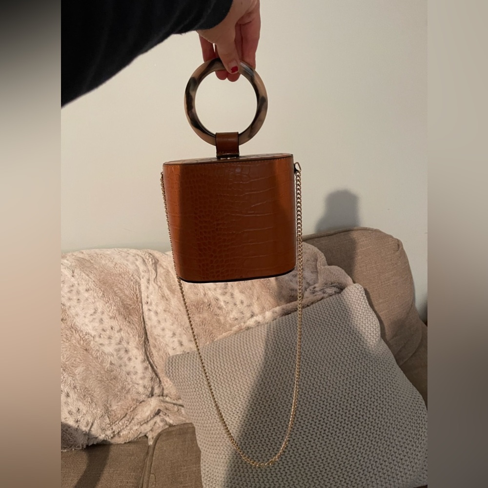 Brown mini leather clutch